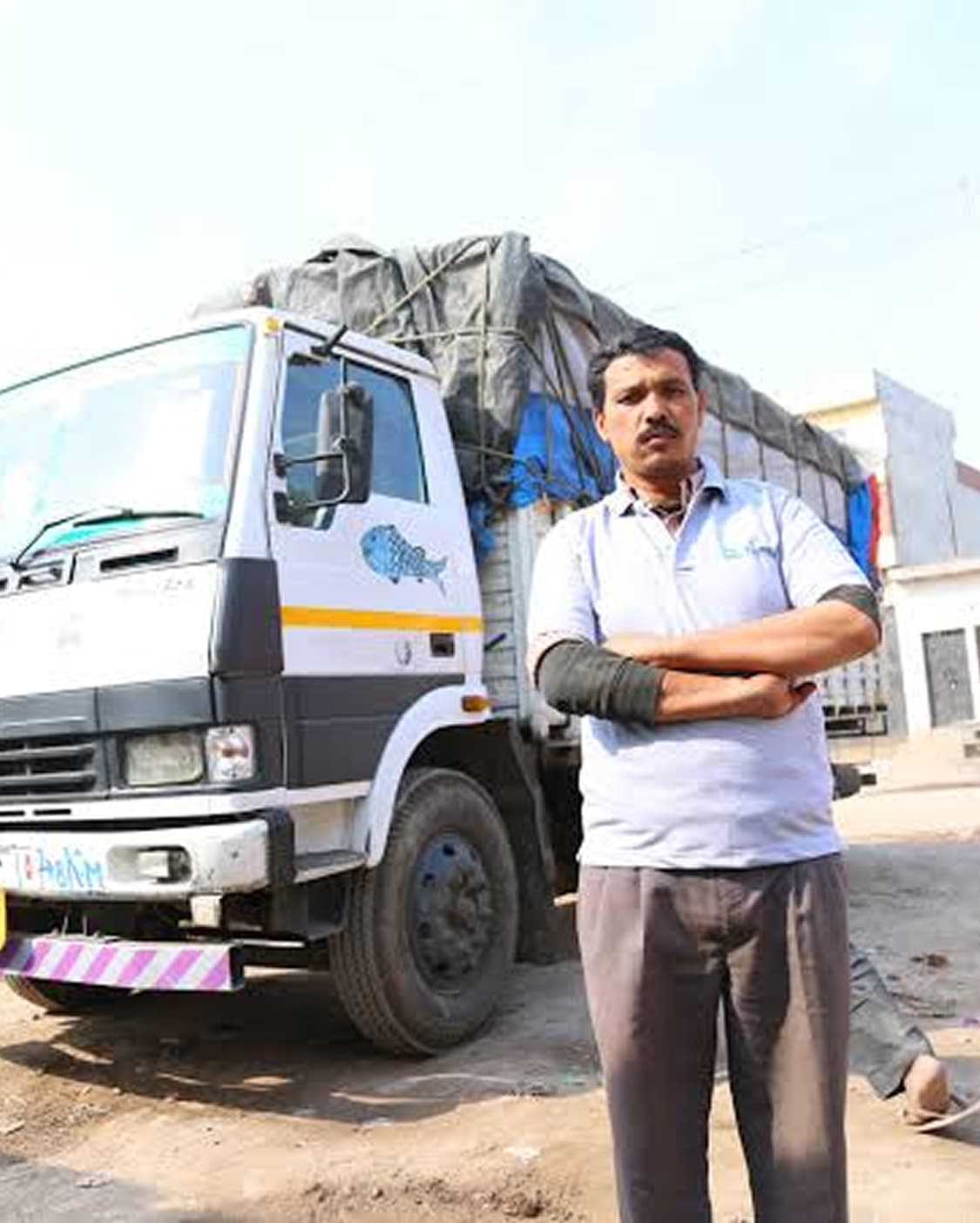 Fleet owner standing beside his truck